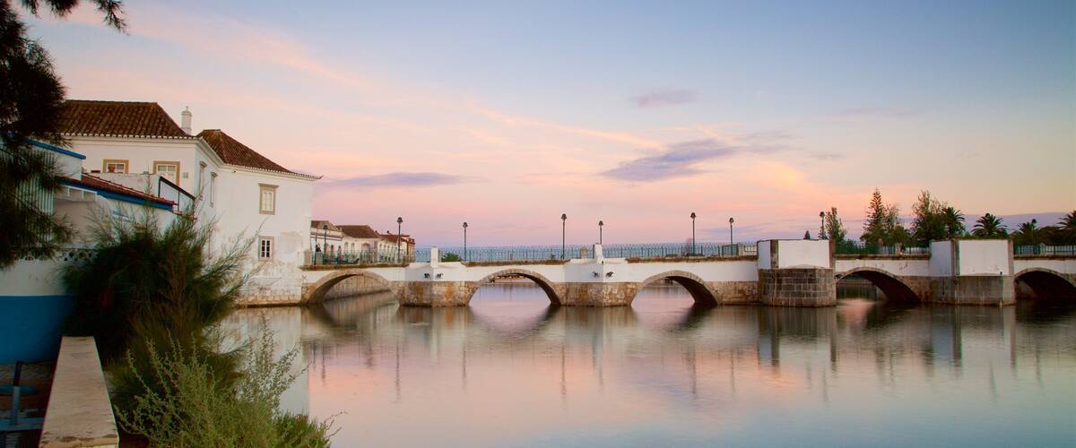 Roman Bridge showing a bridge, a river or creek and a sunset