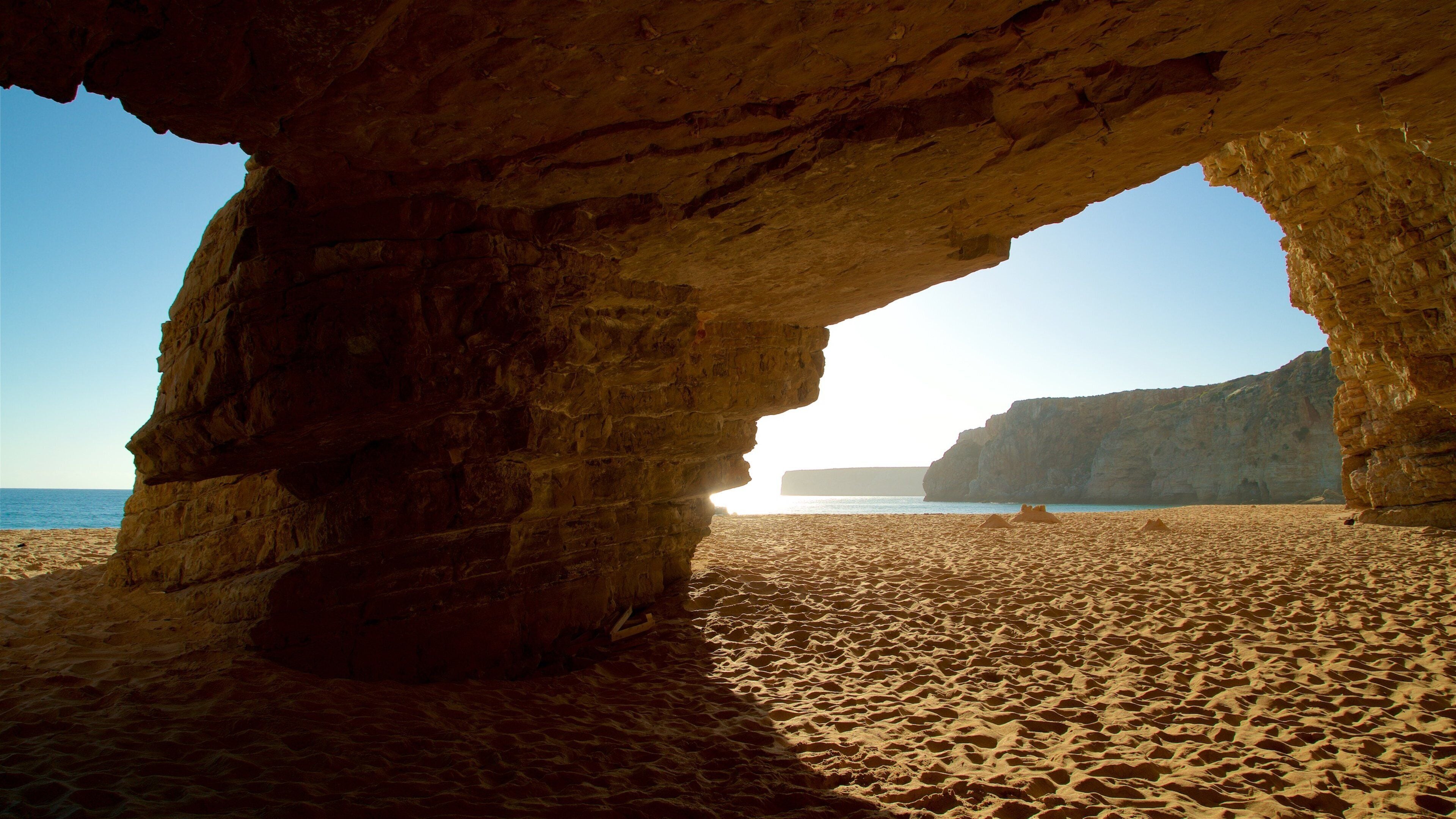 Beliche Beach which includes rugged coastline, a beach and general coastal views