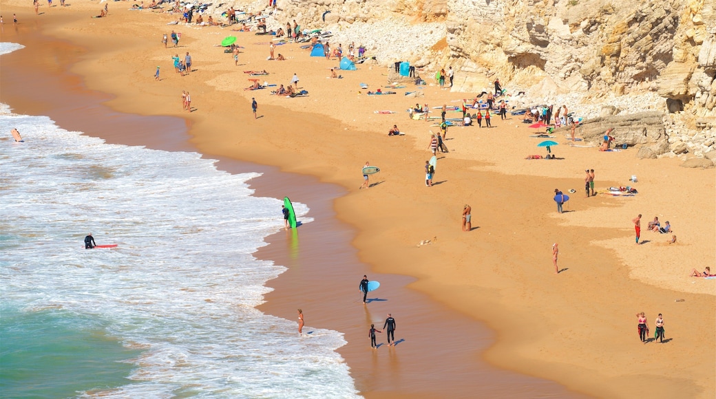 Tonel Beach featuring a sandy beach and general coastal views as well as a small group of people