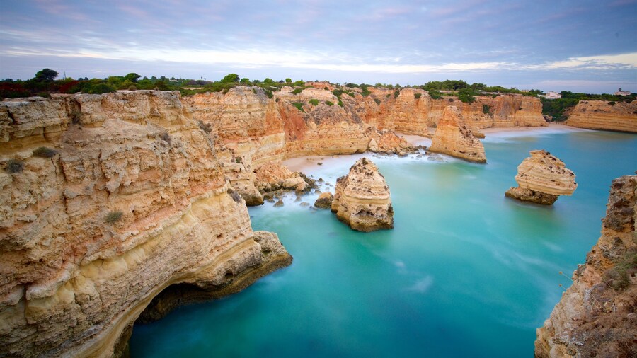 Marinha Beach featuring rocky coastline