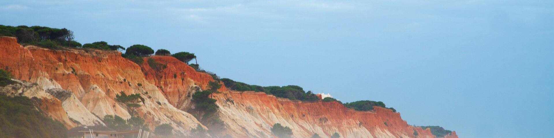 Falesia Beach featuring rocky coastline, general coastal views and a sandy beach
