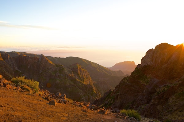 Pico do Ariero featuring mountains and a sunset