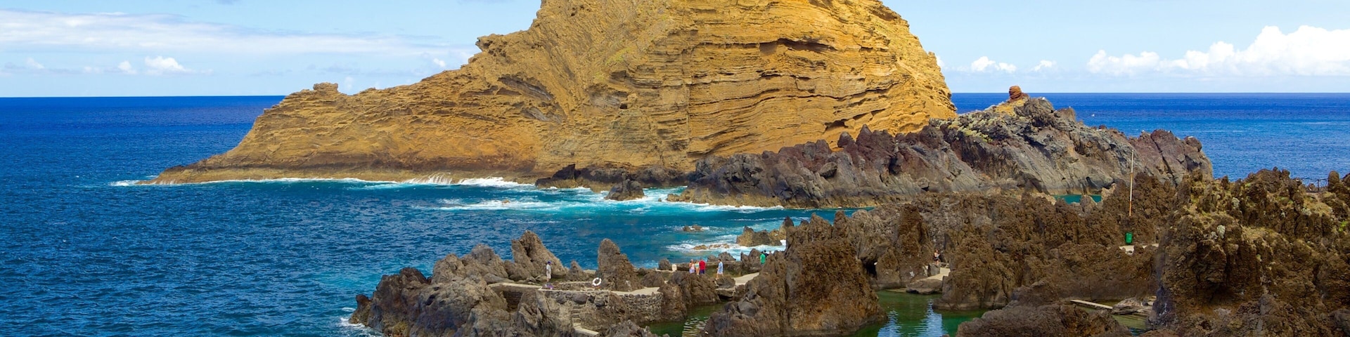 Porto Moniz Natural Pools which includes rugged coastline