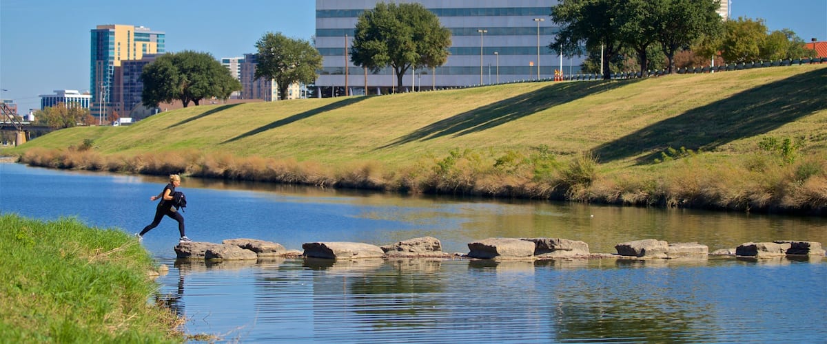 Trinity Park which includes a river or creek as well as an individual femail