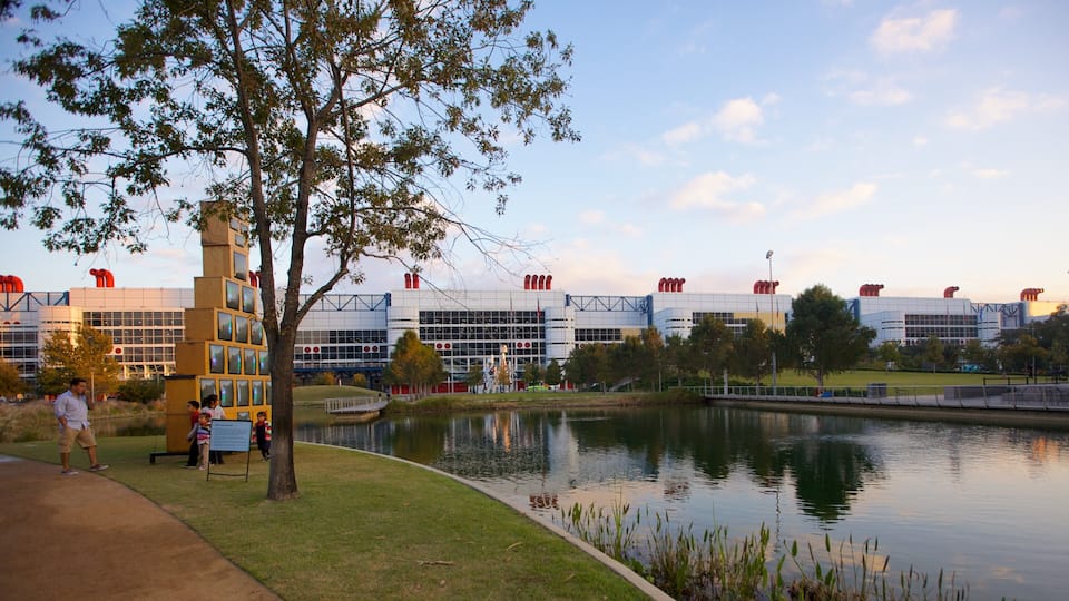 Visitors enjoy a sunny day at Discovery Green Park in Houston Texas with scenic views and vibrant activities