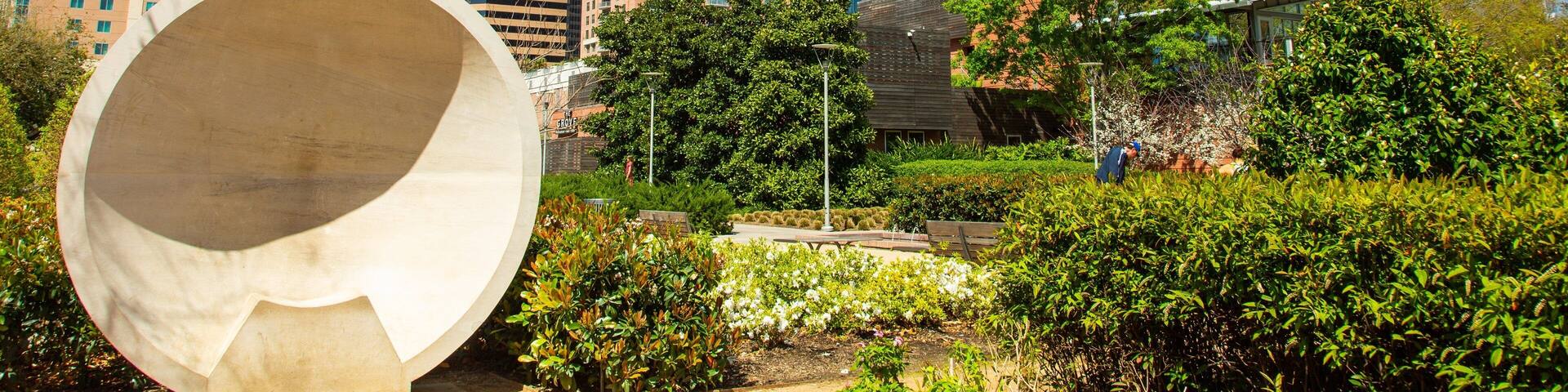 Discovery Green featuring a garden, a city and a skyscraper
