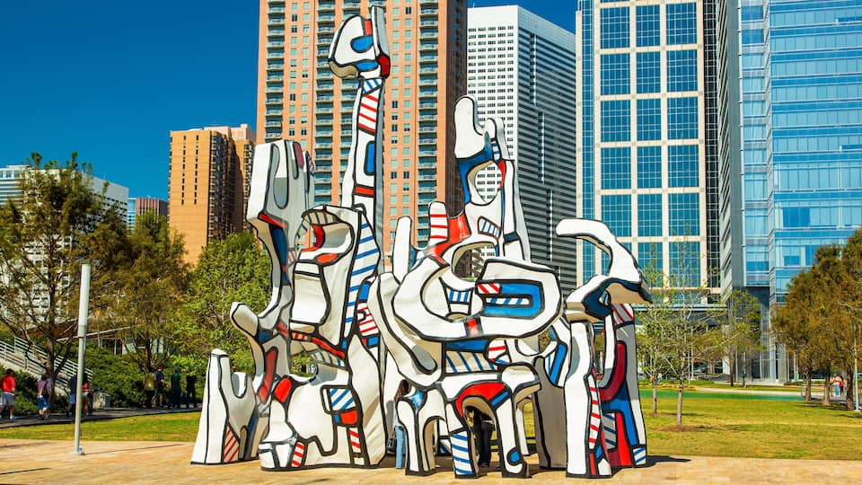 Discovery Green showing a skyscraper, a statue or sculpture and a city