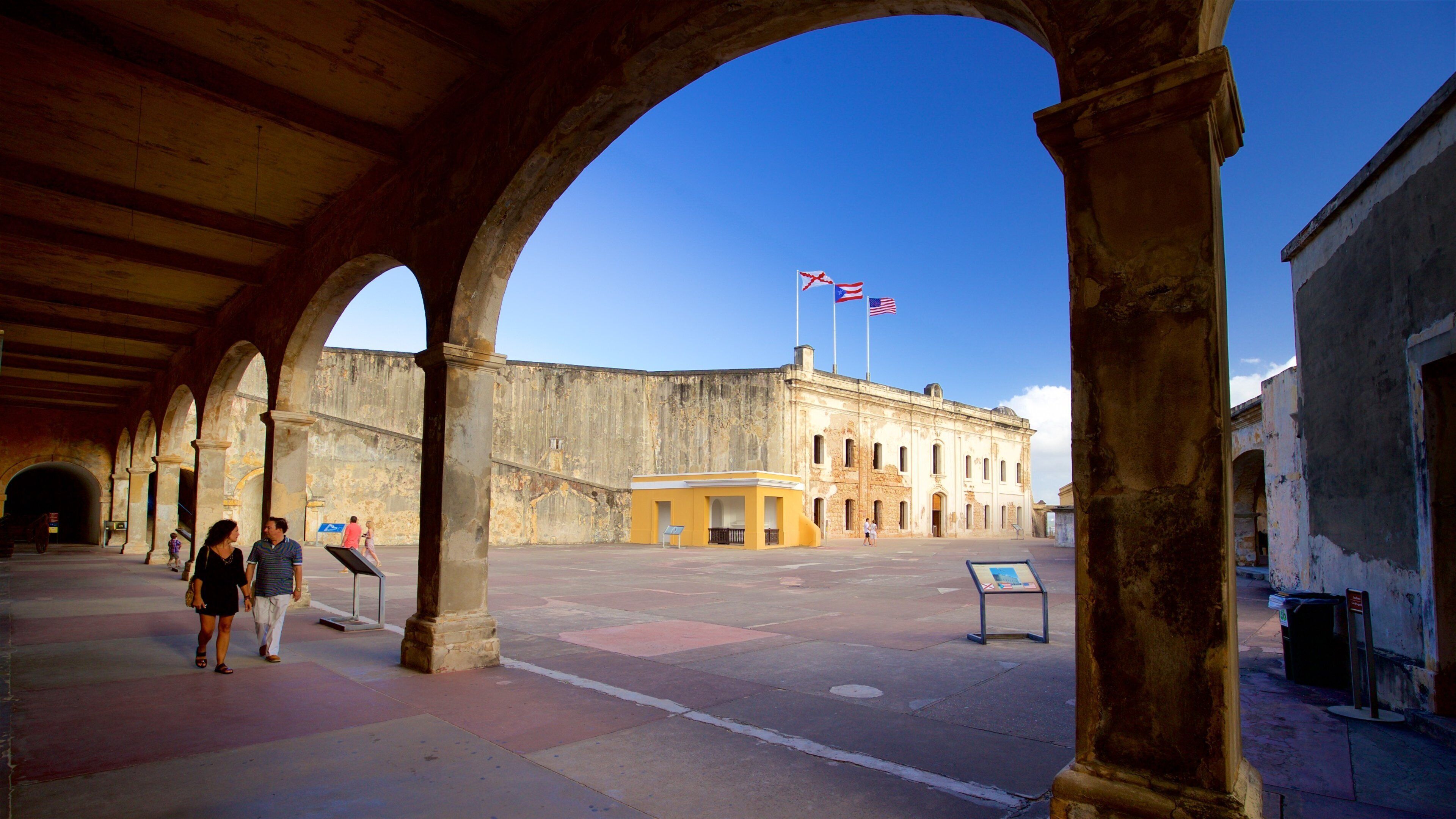 Castillo de San Cristobal featuring a square or plaza and heritage elements as well as a couple