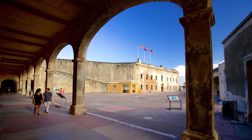 Castillo de San Cristobal featuring a square or plaza and heritage elements as well as a couple