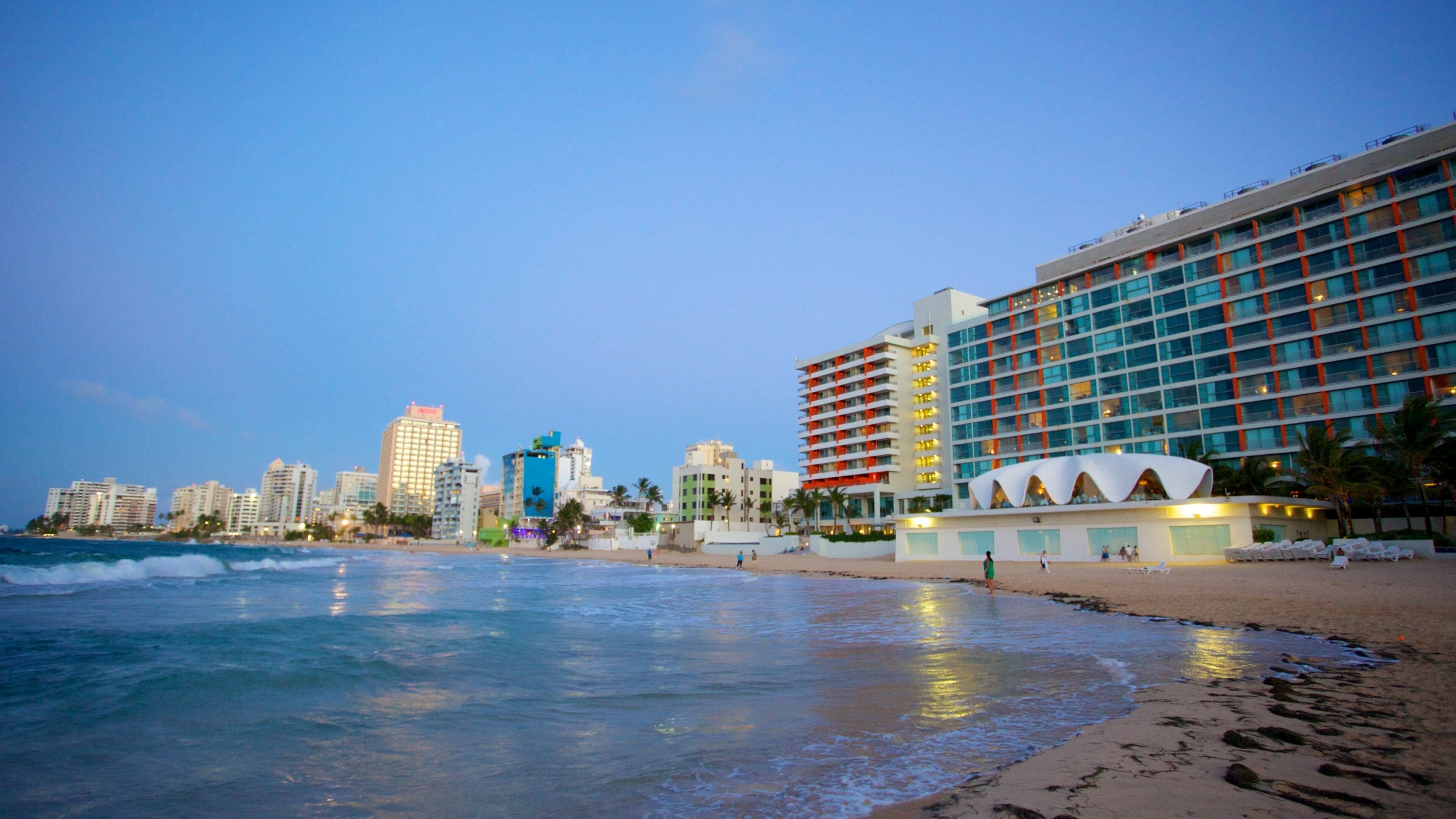 Condado Beach featuring a city, a beach and a bay or harbor