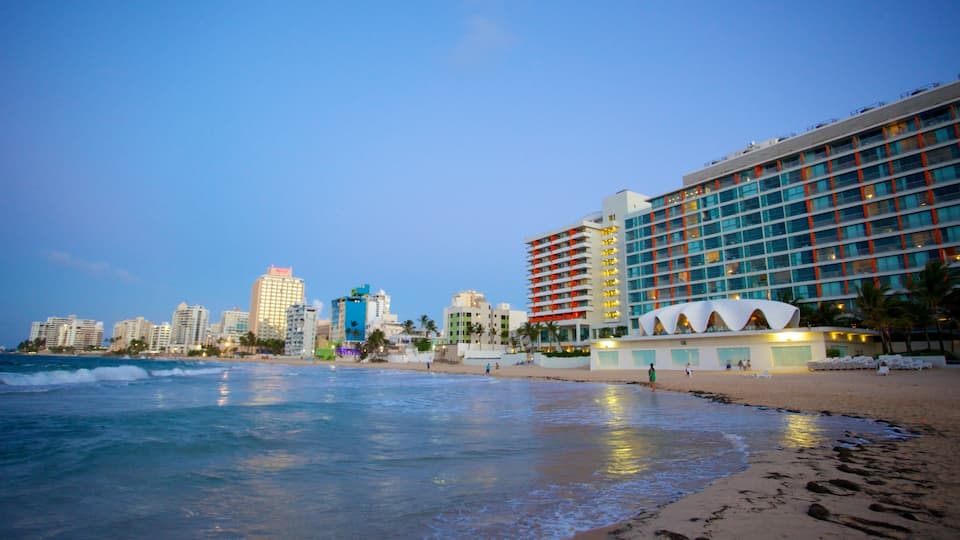 Condado Beach which includes a city, a bay or harbor and a beach