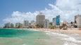 Condado Beach which includes general coastal views and a coastal town
