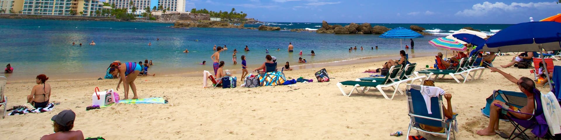 コンダード ビーチ フィーチャー 砂浜 及び 大勢の人々