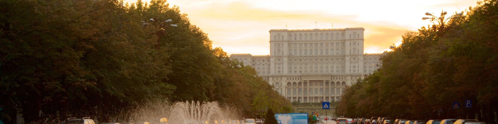 Palace of the Parliament featuring a fountain, street scenes and heritage architecture