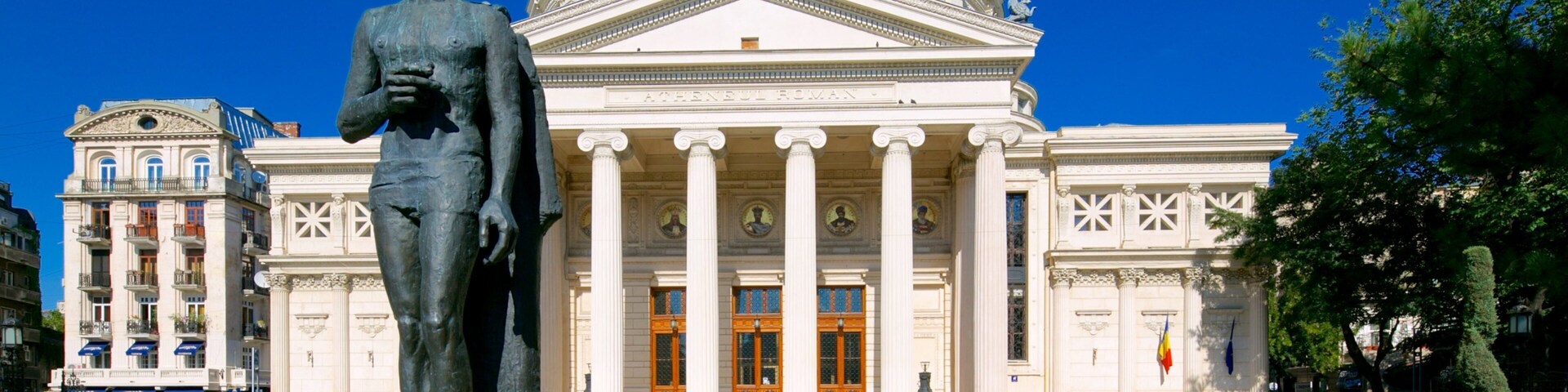 Romanian Athenaeum showing heritage architecture, a park and theater scenes