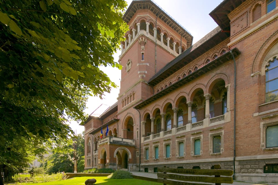 A historic building with arched windows and a tower.