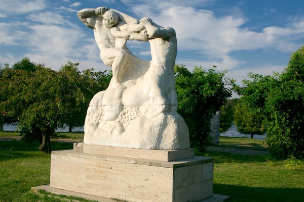 Herastrau Park featuring outdoor art, a garden and a statue or sculpture