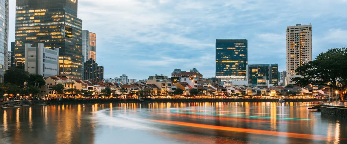 Boat Quay featuring a city, a sunset and a bay or harbor