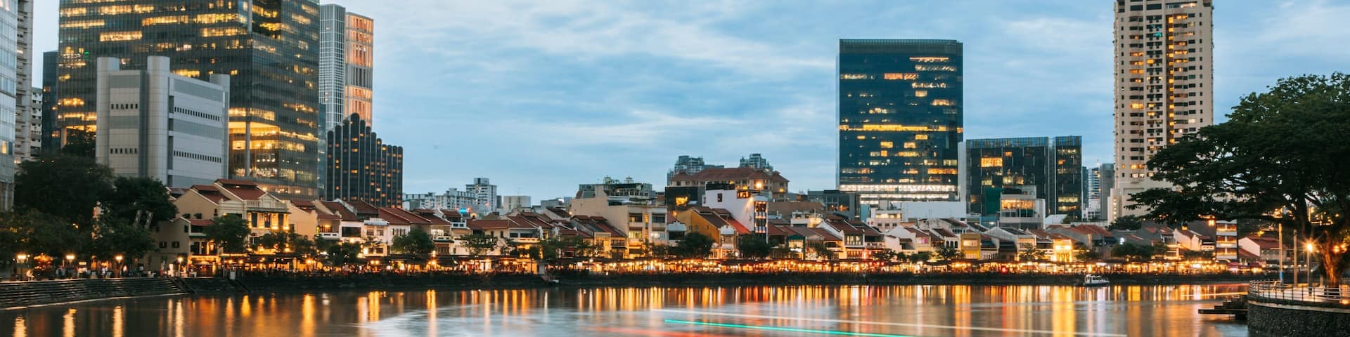 Boat Quay featuring a city, a sunset and a bay or harbor