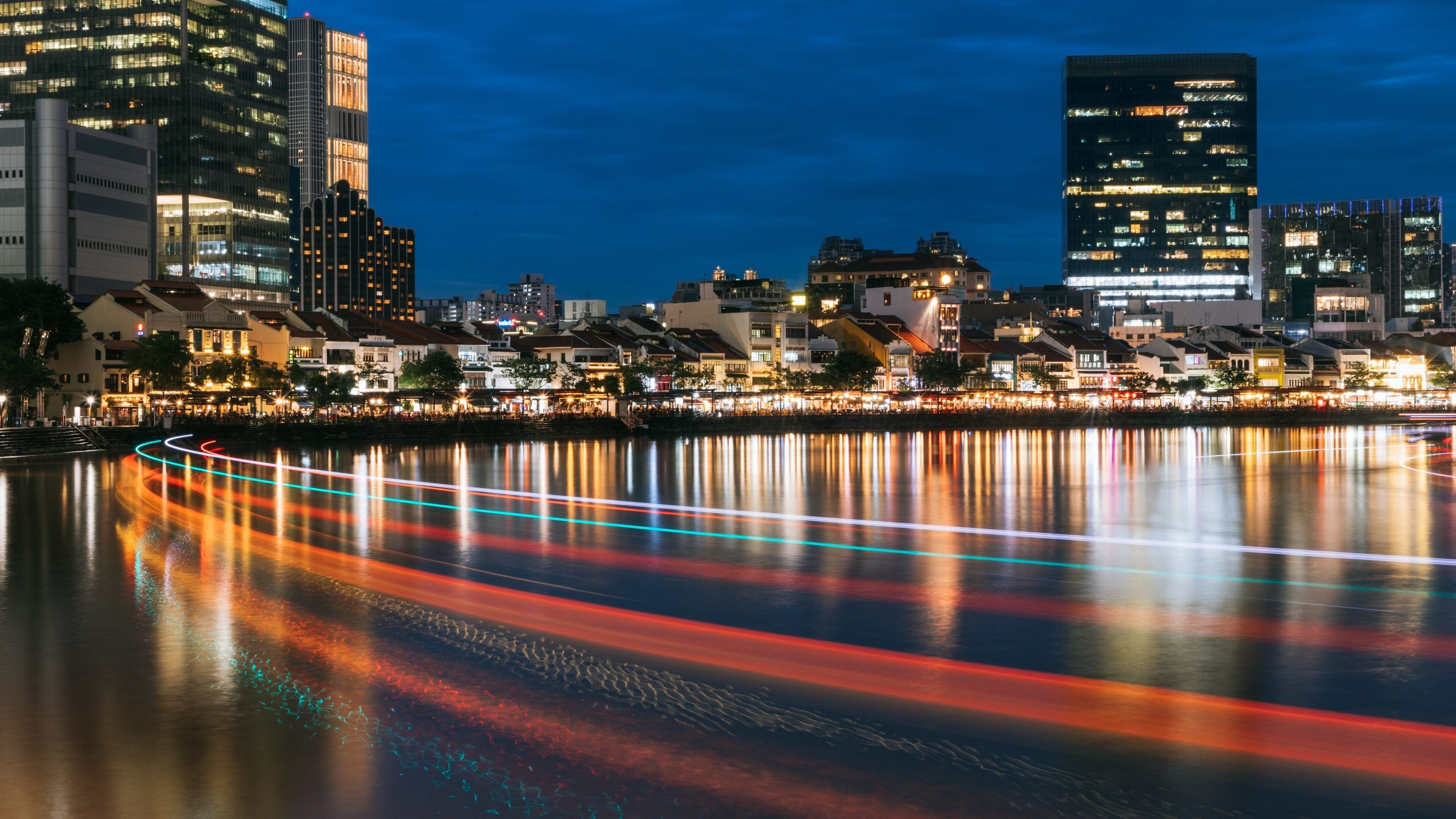 Boat Quay showing a bay or harbor, night scenes and a city