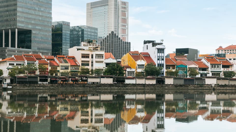 Boat Quay which includes a bay or harbor