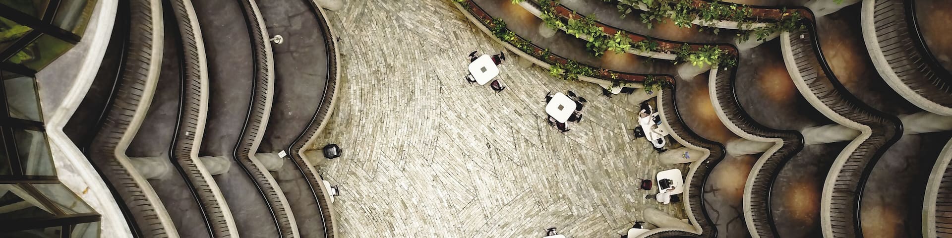Top view inside The Hive - learning hub designed as a shape of honey comb at the Nanyang technological university in Singapore. Modern design architecture. Students in the background.