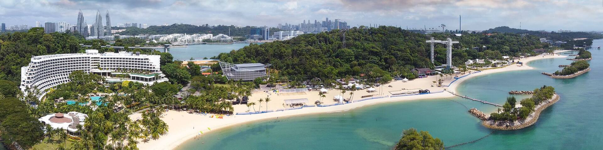 Panoramic aerial view of Siloso Beach and Sentosa Island at sunset, Singapore