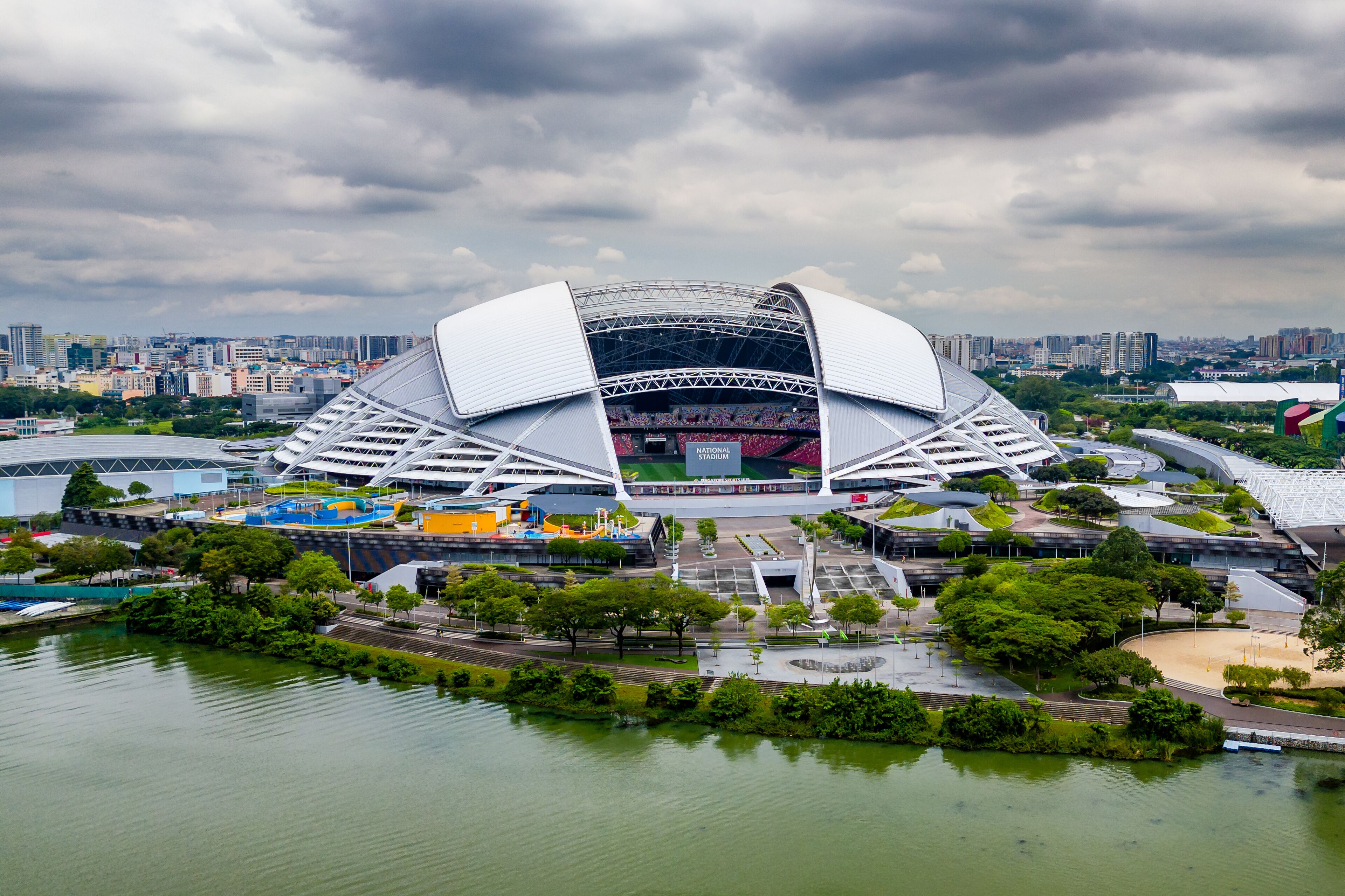 Aerial view of the Singapore National Stadium located next to the Kallang Basin and reservoir