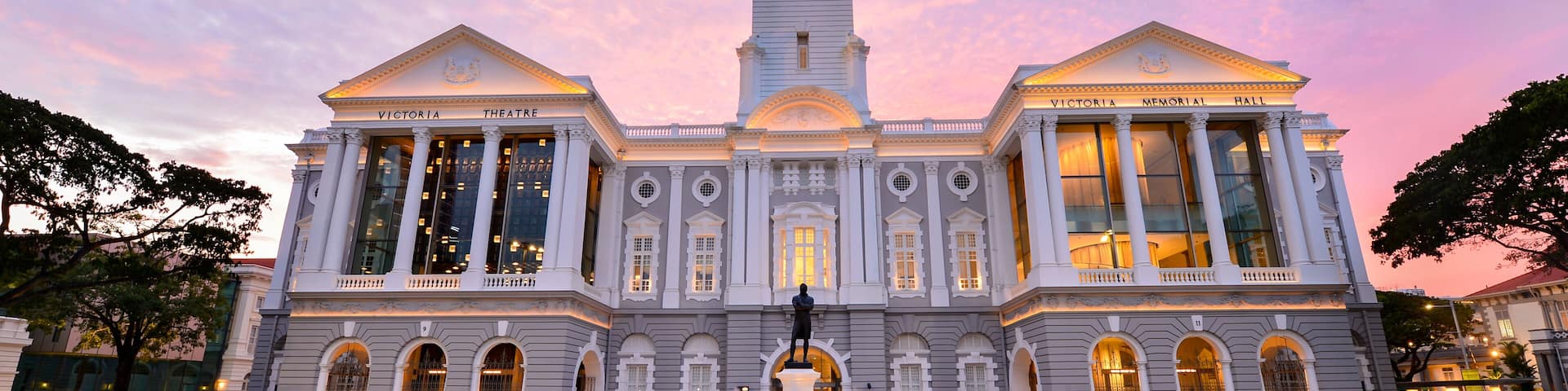 Victoria Theatre and Concert Hall clock tower on during sunset ,Singapore