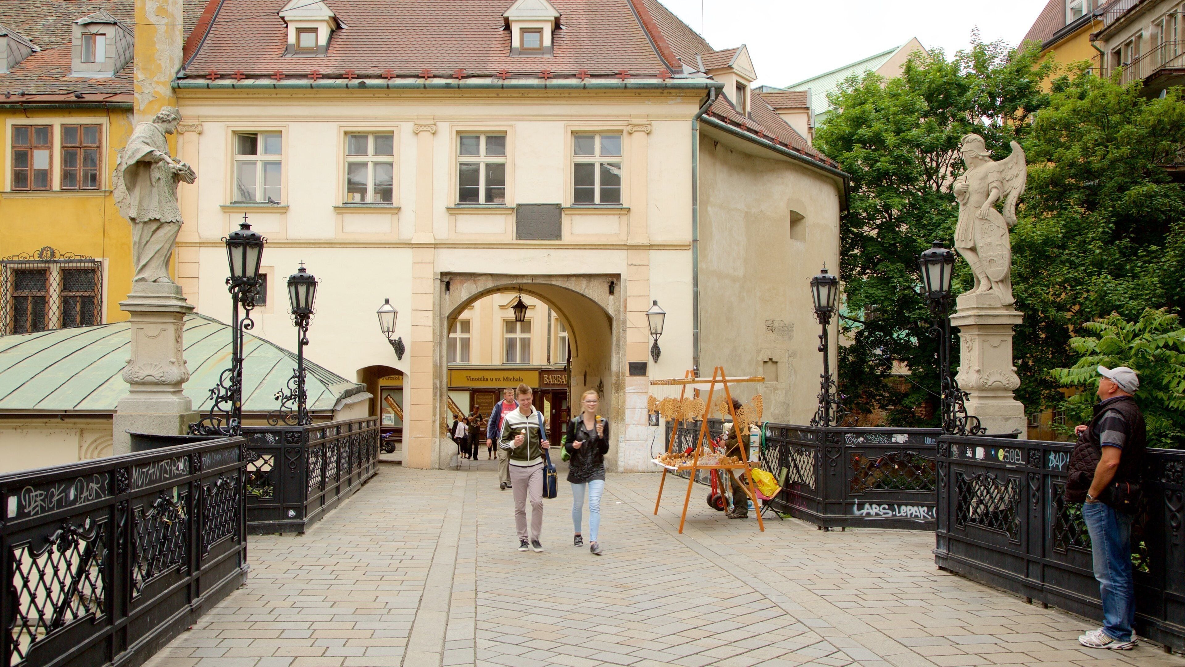 Michael\'s Gate which includes a city and street scenes as well as a couple