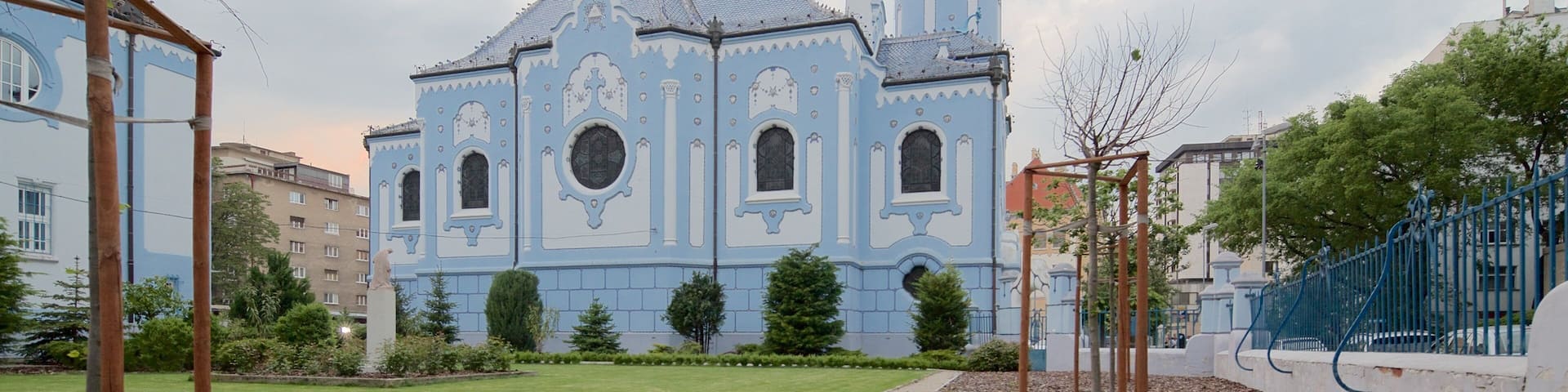 Blue Church featuring a church or cathedral and a garden