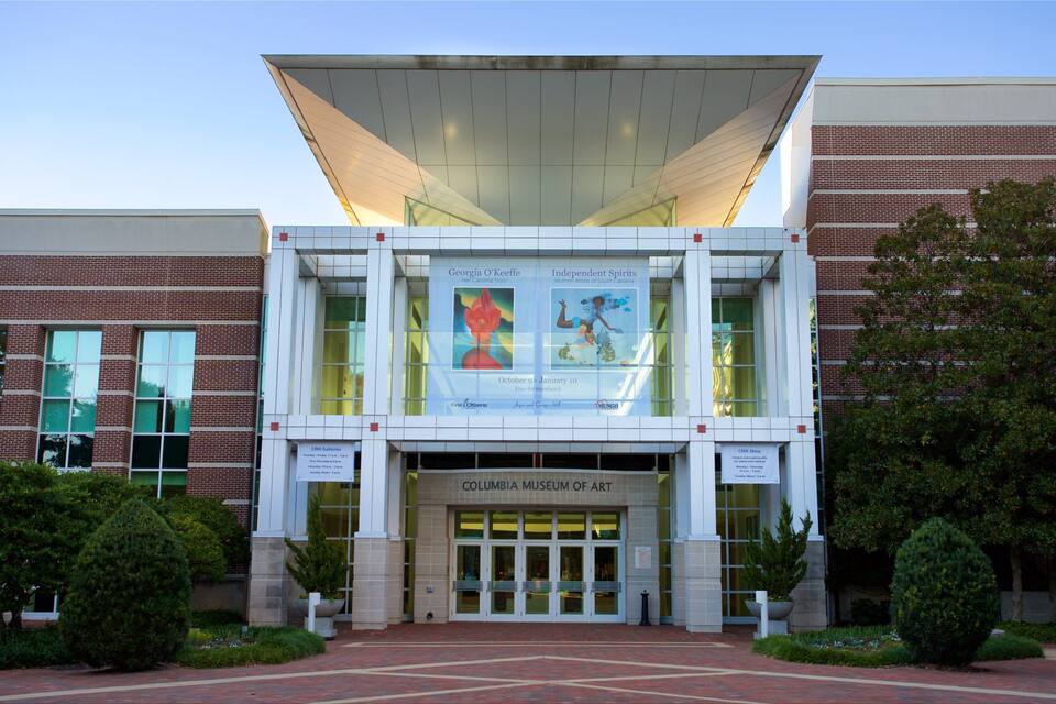 The Columbia Museum of Art with a modern design, featuring large glass windows and a prominent entrance.