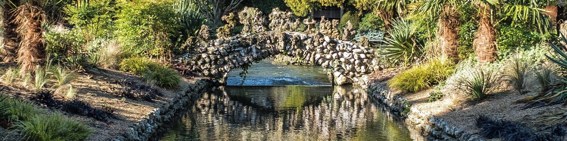 The River Lavant running through the beautifully landscaped West Dean Gardens near Chichester, England UK.
Reasonable admission prices and kids free entry (check first though as kids are charged on "event" days.