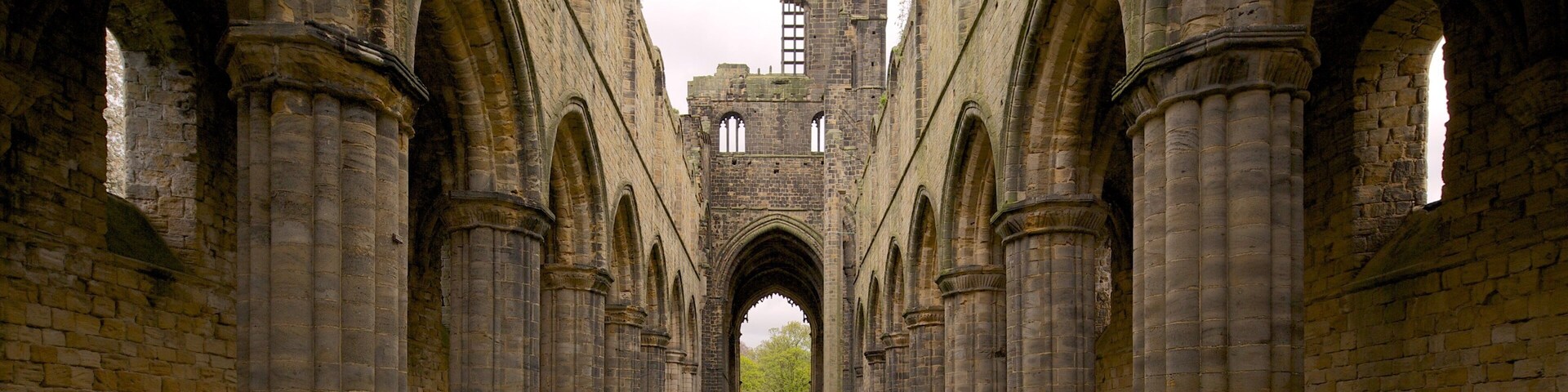 Kirkstall Abbey featuring heritage architecture and a ruin
