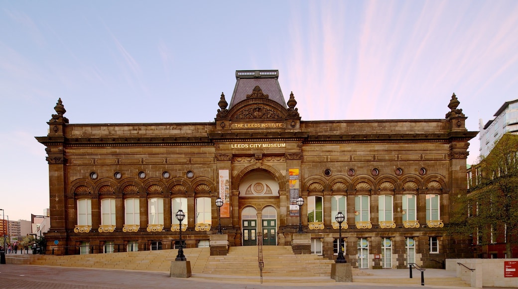 Millennium Square showing street scenes, heritage architecture and a sunset