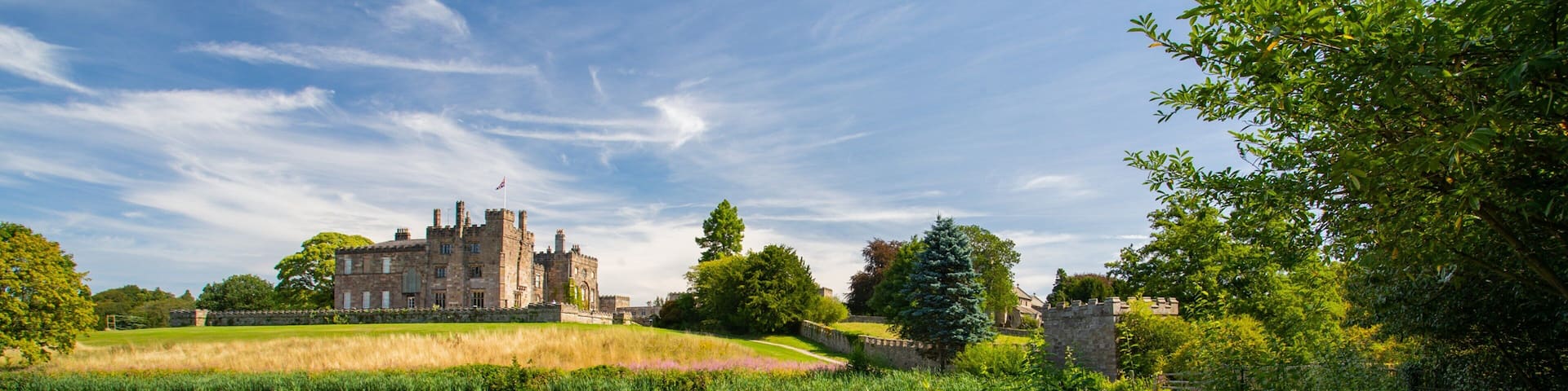 Ripley Castle and Gardens which includes heritage architecture, a lake or waterhole and chateau or palace