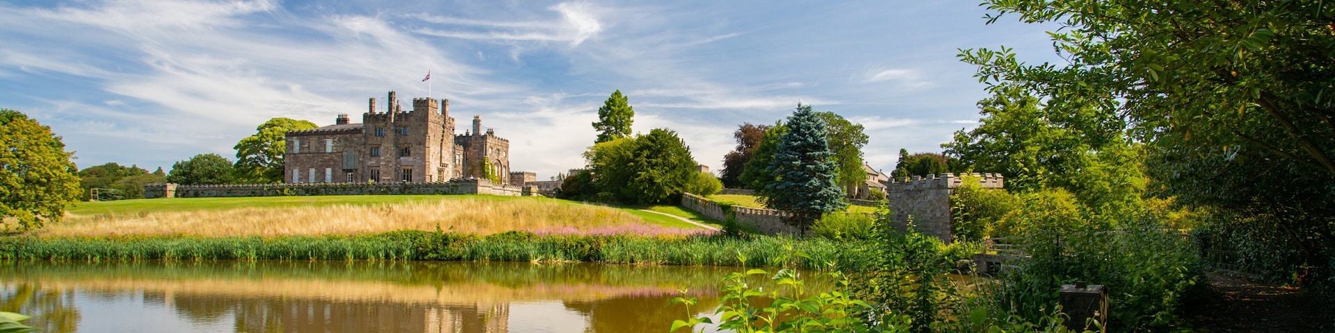 Ripley Castle and Gardens which includes heritage architecture, a lake or waterhole and chateau or palace