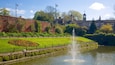 Roundhay Park which includes a fountain, a river or creek and a park