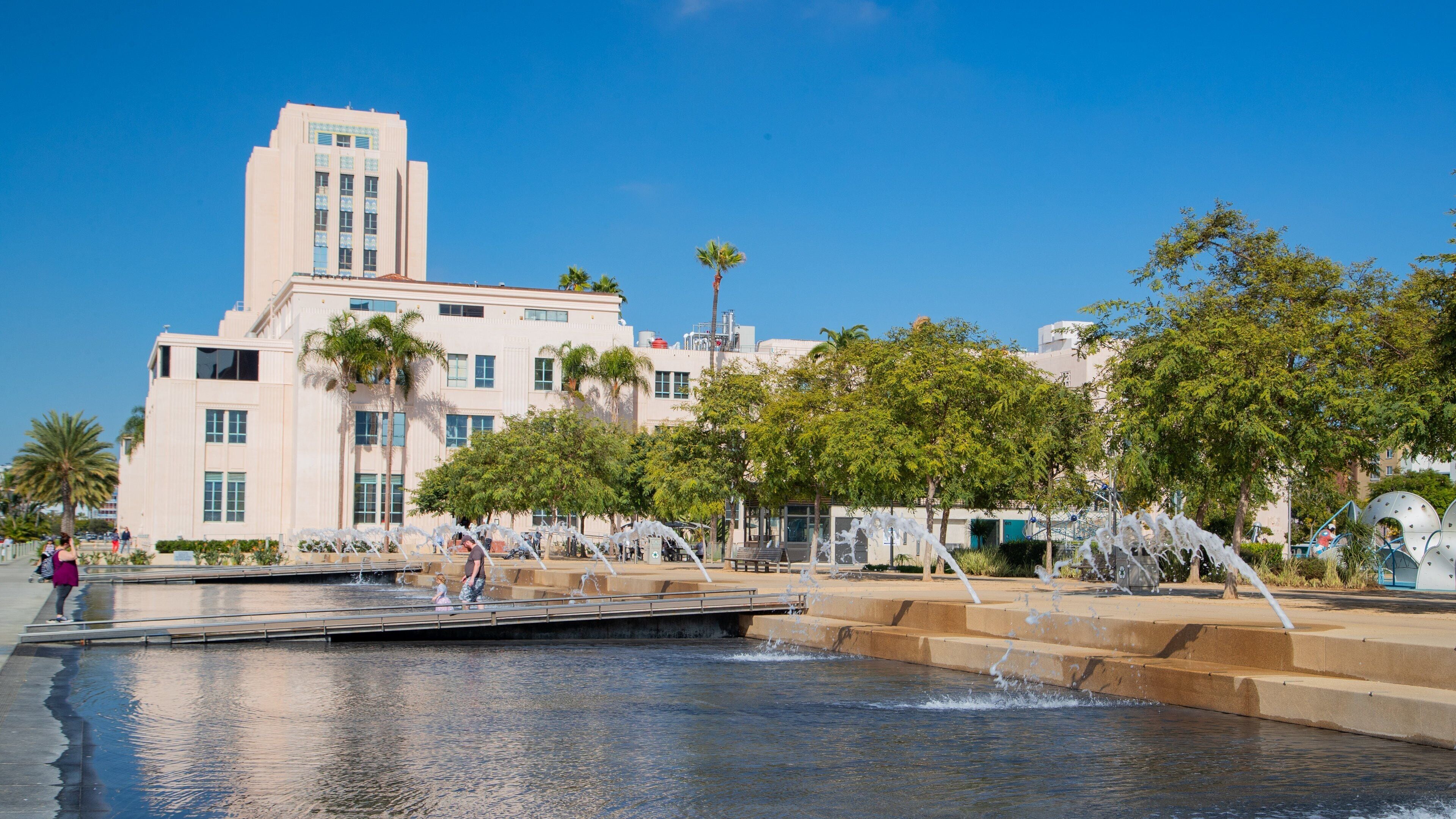 Waterfront Park which includes a river or creek and a fountain