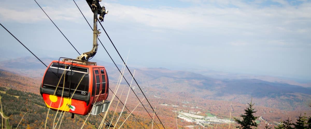 Killington Ski Resort featuring autumn colours, a gondola and forest scenes
