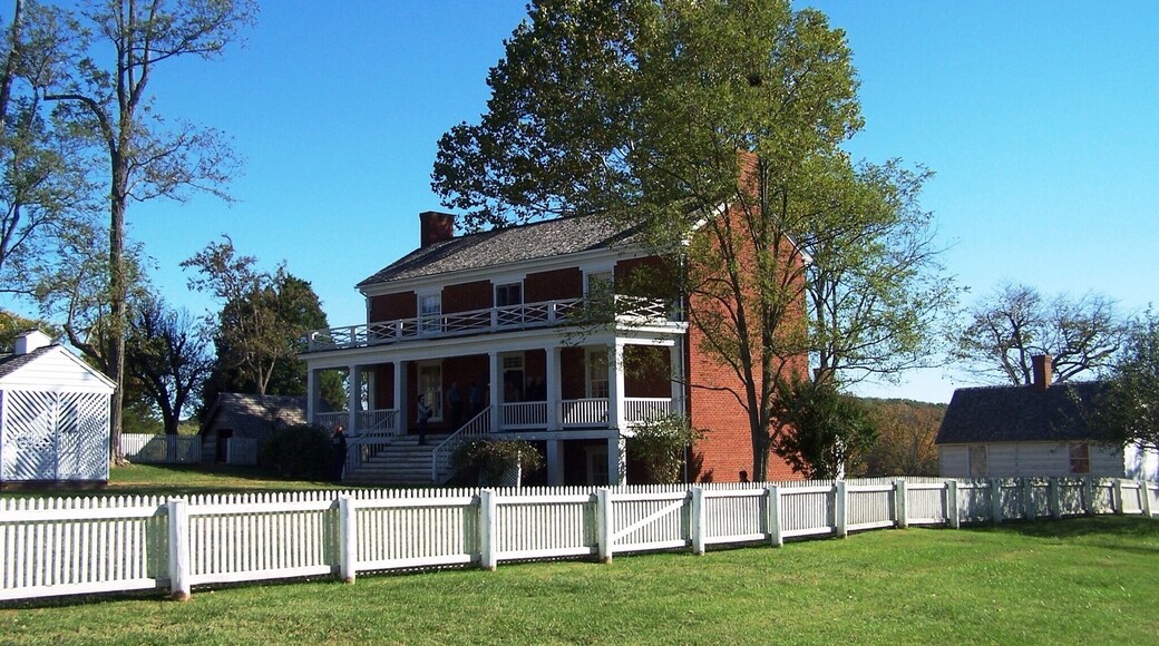 The initial engagement on July 21, 1861 of what would become the First Battle of Bull Run (First Manassas) took place on McLean's farm in Manassas, Virginia. Union Army artillery fired at McLean's house, which was being used as a headquarters for Confederate Brigadier General P. G. T. Beauregard, and a cannonball dropped through the kitchen fireplace.
McLean was a retired major in the Virginia militia, but at 47, he was too old to return to active duty at the outbreak of the Civil War. In the spring of 1863, he and his family moved about 120 miles south to Appomattox County, Virginia, near a dusty, crossroads community called Appomattox Court House.
On April 9, 1865, the war revisited McLean. Confederate General Robert E. Lee was about to surrender to Lieutenant General Ulysses S. Grant. He sent a messenger to Appomattox Court House to find a place to meet. On April 8, 1865, the messenger knocked on McLean's door and requested the use of his home, to which McLean reluctantly agreed. Lee surrendered to Grant in the parlor of McLean's house, effectively ending the Civil War. Later, McLean is supposed to have said "The war began in my front yard and ended in my front parlor."