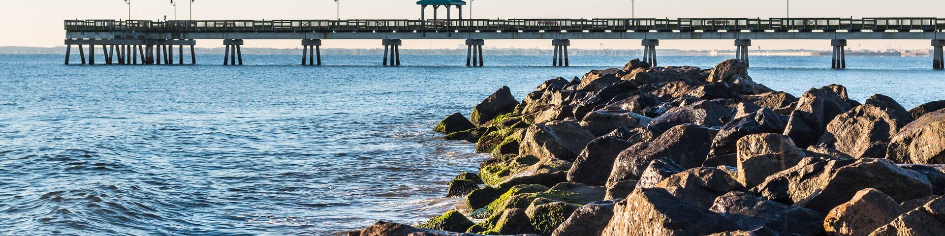 Buckroe Beach with fishing pier and rock jetty in Hampton, Virginia.