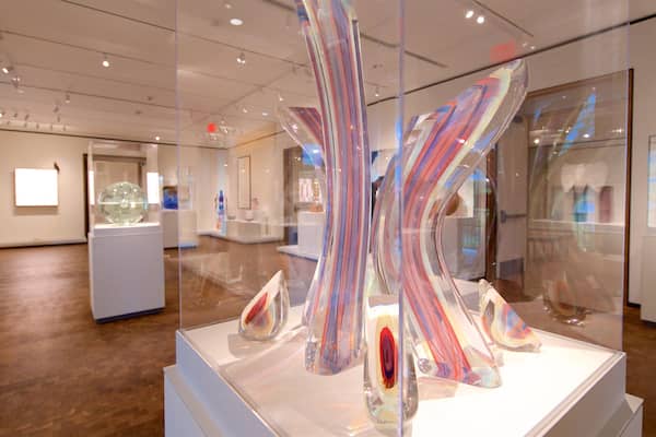 An art gallery with modern sculptures and glass installations.
