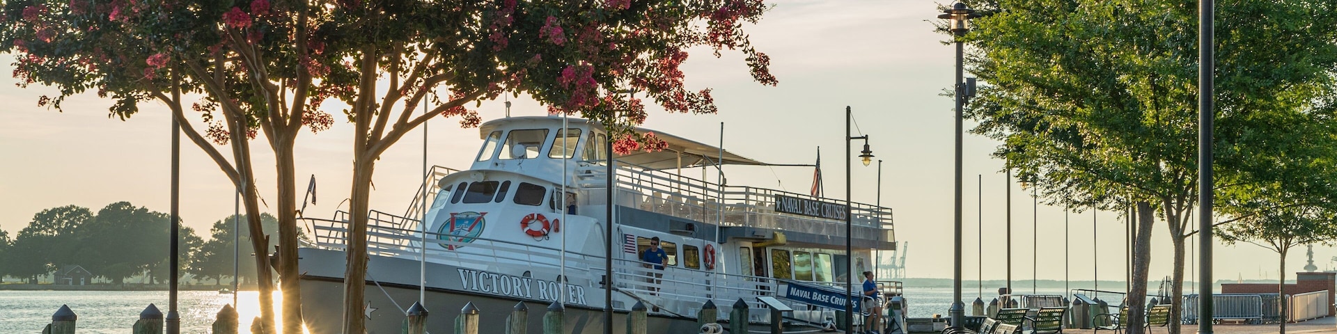 Town Point Park featuring a sunset, a garden and a bay or harbor