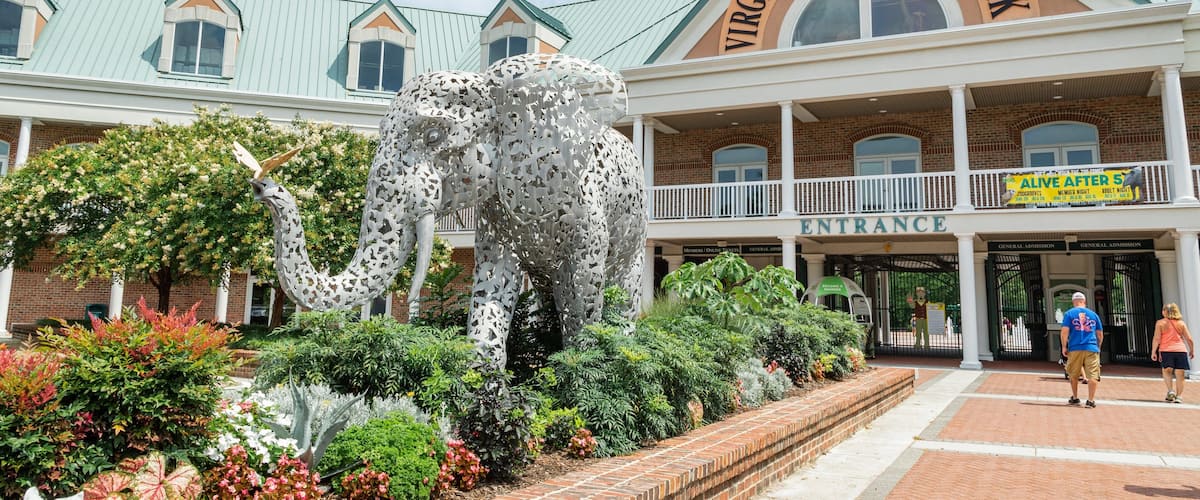 Virginia Zoo featuring signage, outdoor art and a park