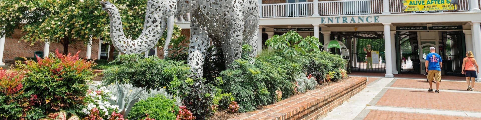 Virginia Zoo featuring signage, outdoor art and a park