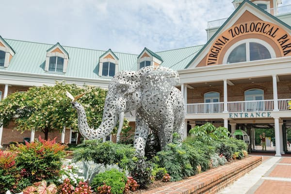 Virginia Zoo featuring signage, outdoor art and a park