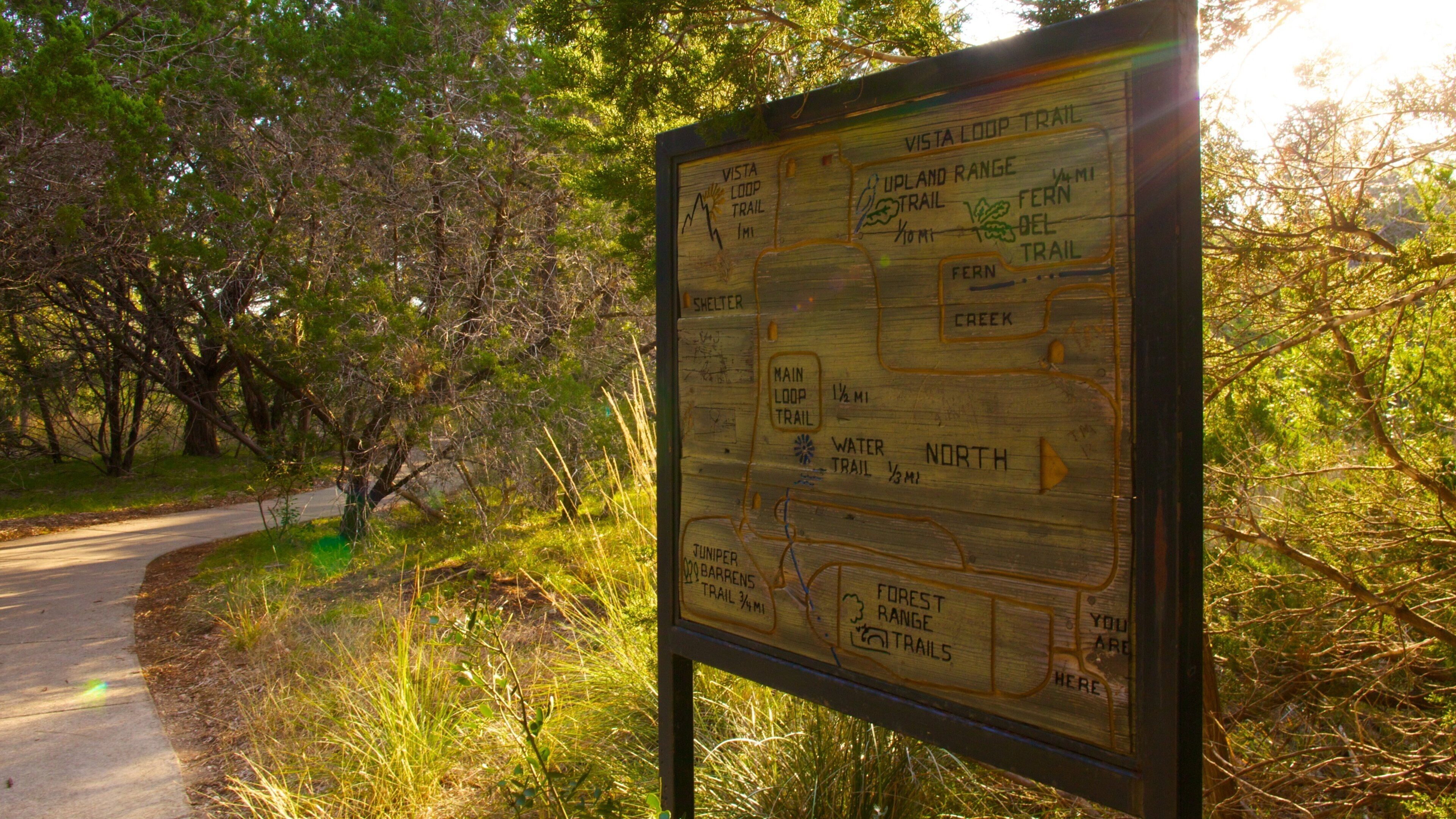 Friedrich Wilderness Park which includes signage, a park and tranquil scenes