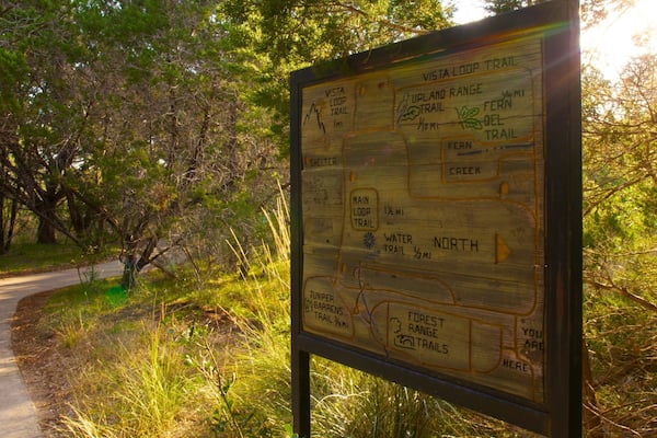 Friedrich Wilderness Park which includes signage, a park and tranquil scenes
