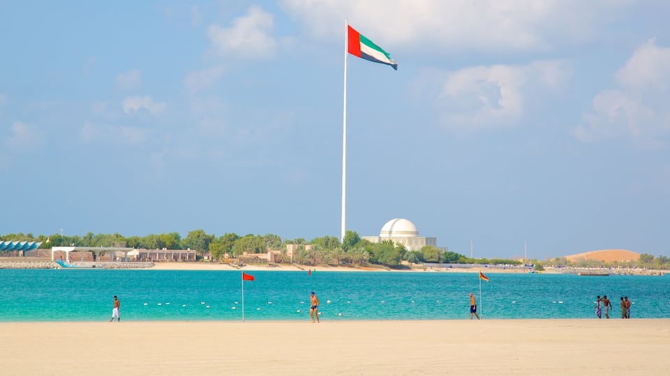 The Corniche which includes a beach, tropical scenes and general coastal views